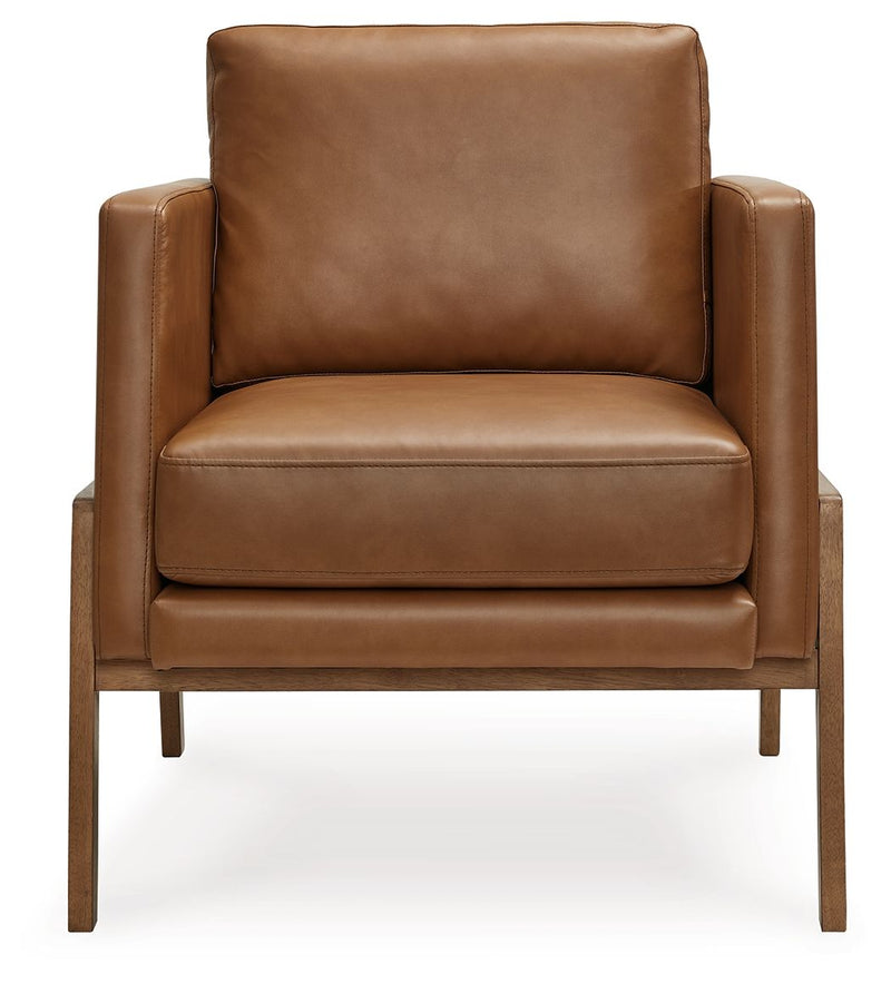 Caramel leather-look accent chair with wide arms, cushioned seat, and wood legs