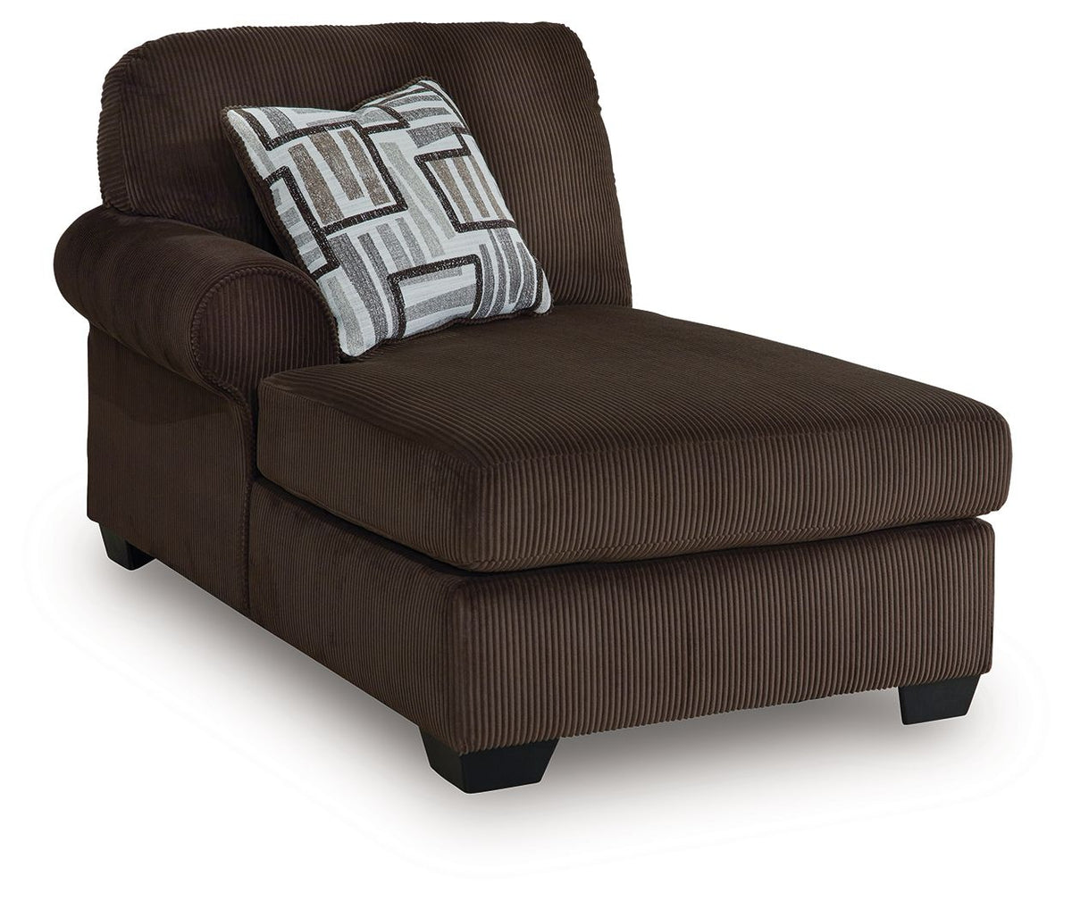 Dark brown chaise lounge section with patterned throw pillow and striped upholstery