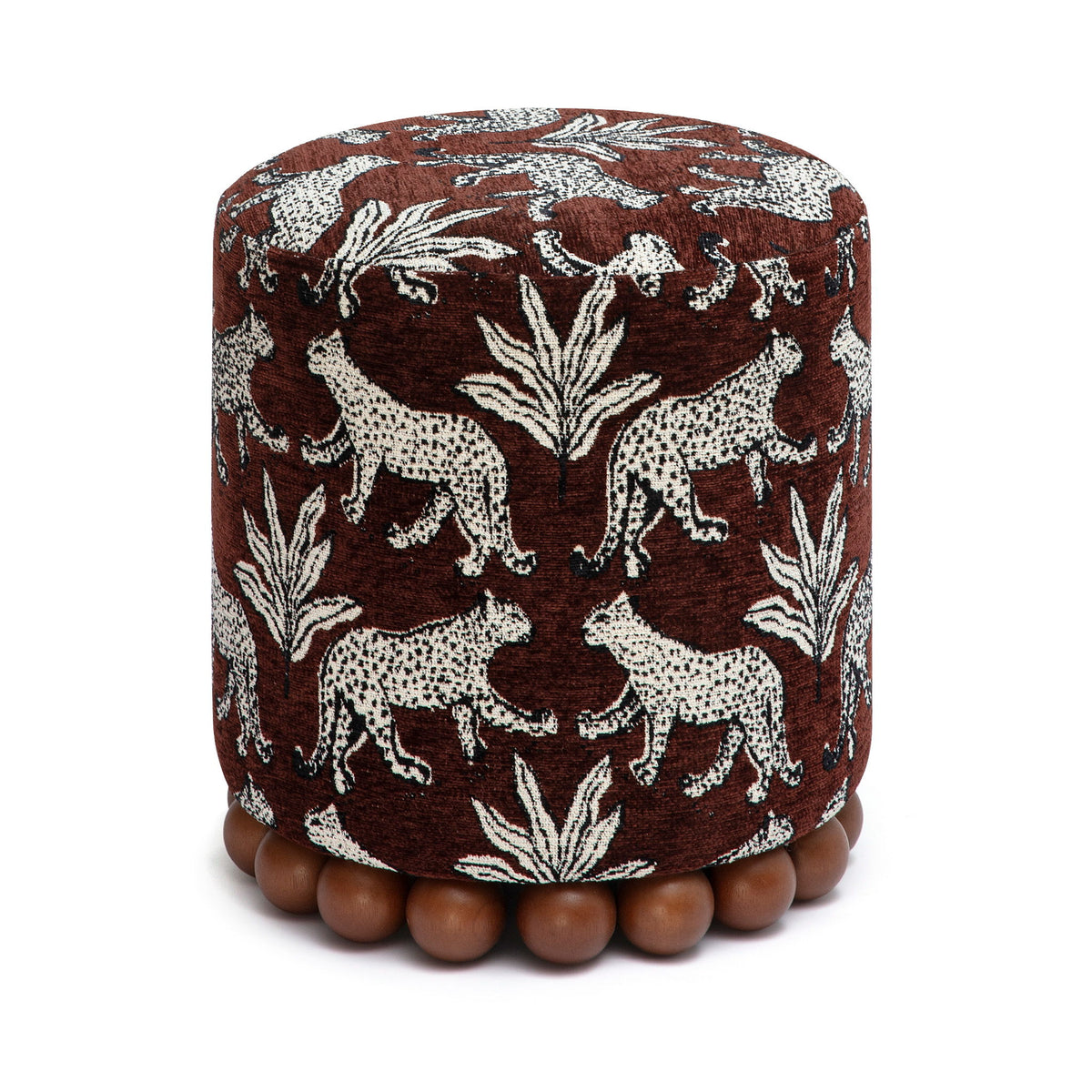 Dark brown animal-print ottoman with dark wood ball base; round cushioned top.