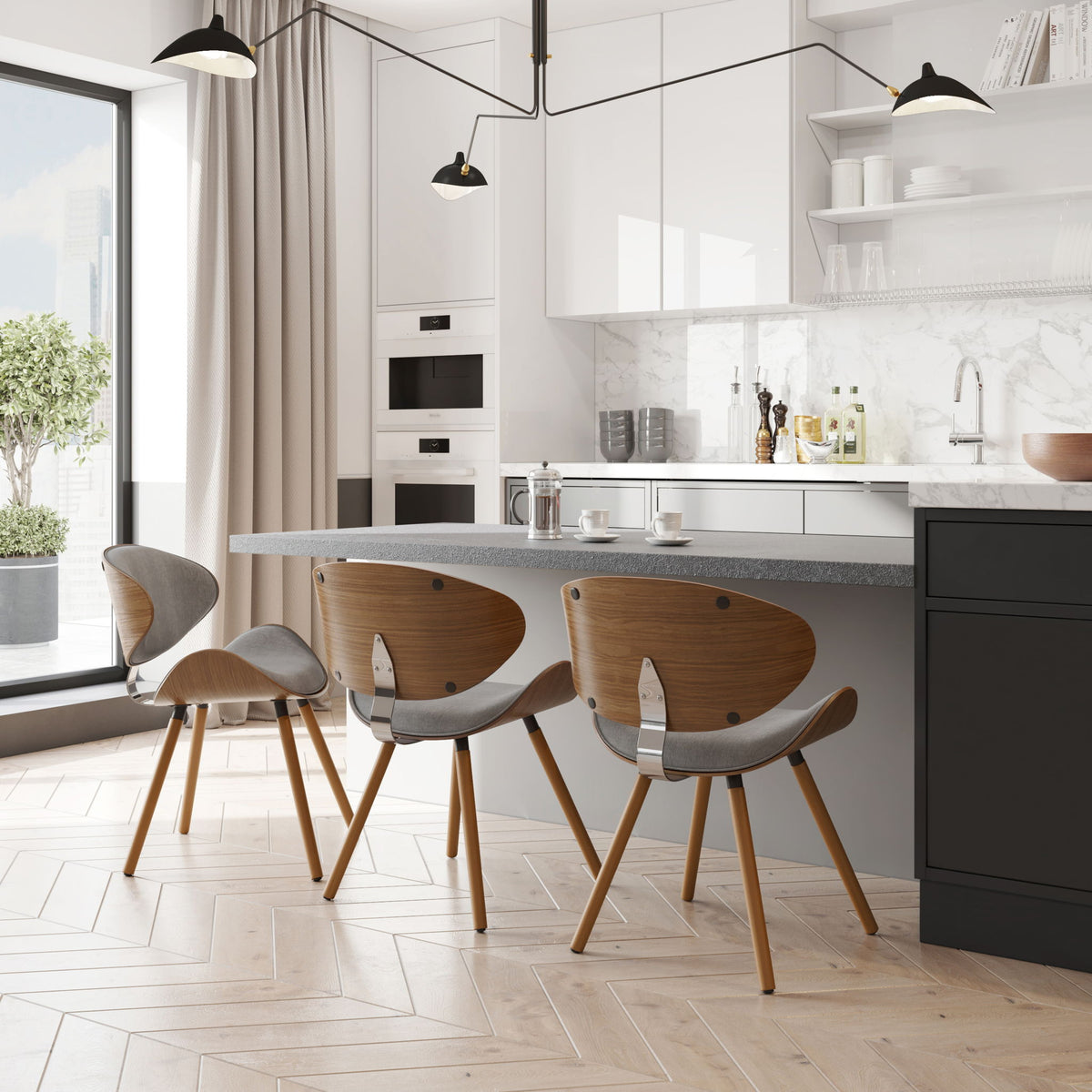 Set of gray upholstered dining chairs with wood legs in a kitchen dining area