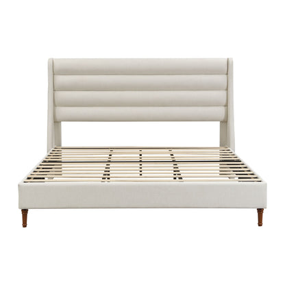 Beige upholstered platform bed with wave headboard and slatted mattress base
