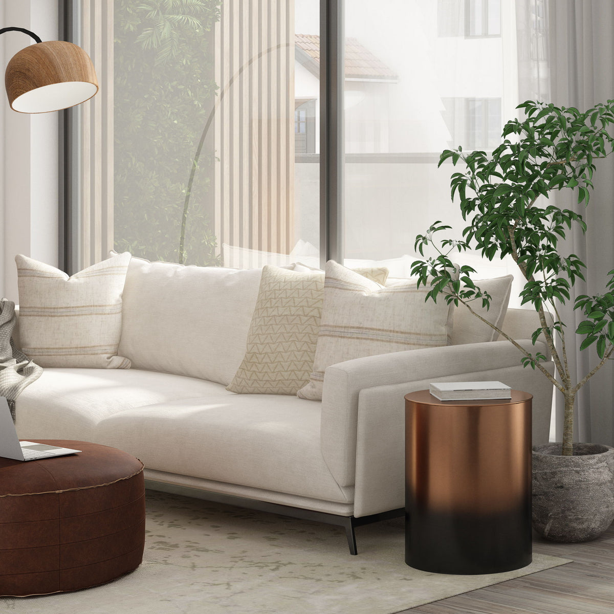 Bronze-to-black ombre metal cylinder accent table with round top in living room