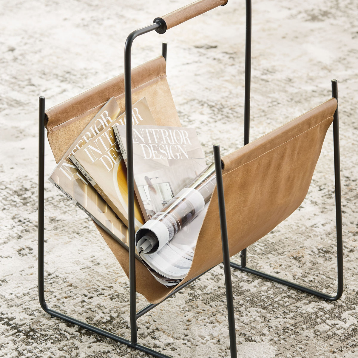 Brown magazine rack holding magazines with black metal frame