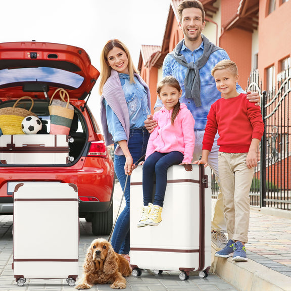 White hardshell spinner suitcase with telescopic handle and four rolling wheels.
