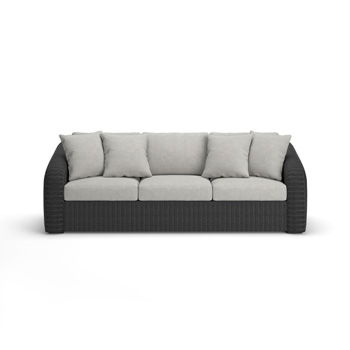 Gray sofa with three seat cushions, four back cushions, and a dark woven frame