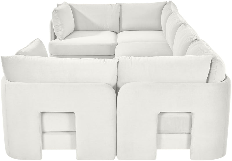 White velvet U-shaped sectional sofa with rounded back and padded armrests