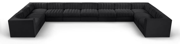 Black modular sectional sofa with velvet-look upholstery and tufted cushions