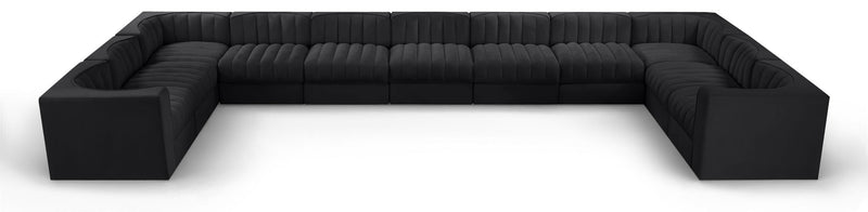 Black modular sectional sofa with velvet-look upholstery and tufted cushions