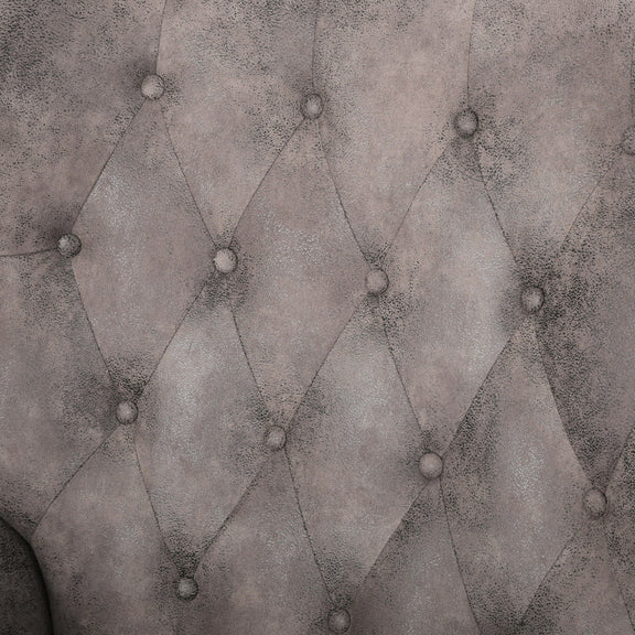 Gray recliner chair upholstery close-up with diamond tufting and button details