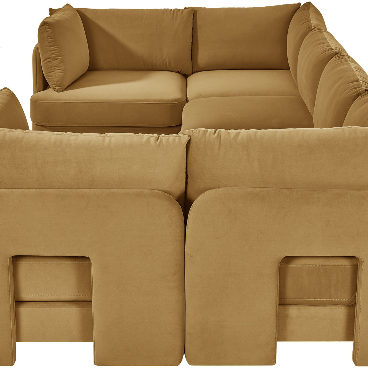 Tan velvet U-shaped sectional sofa with thick cushions and curved arm panels