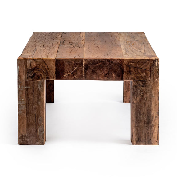 Giza table in dark rustic wood with thick plank top and carved supports