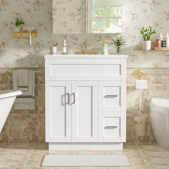 White bathroom vanity with sink, two cabinet doors, and stacked drawer fronts with bar pulls