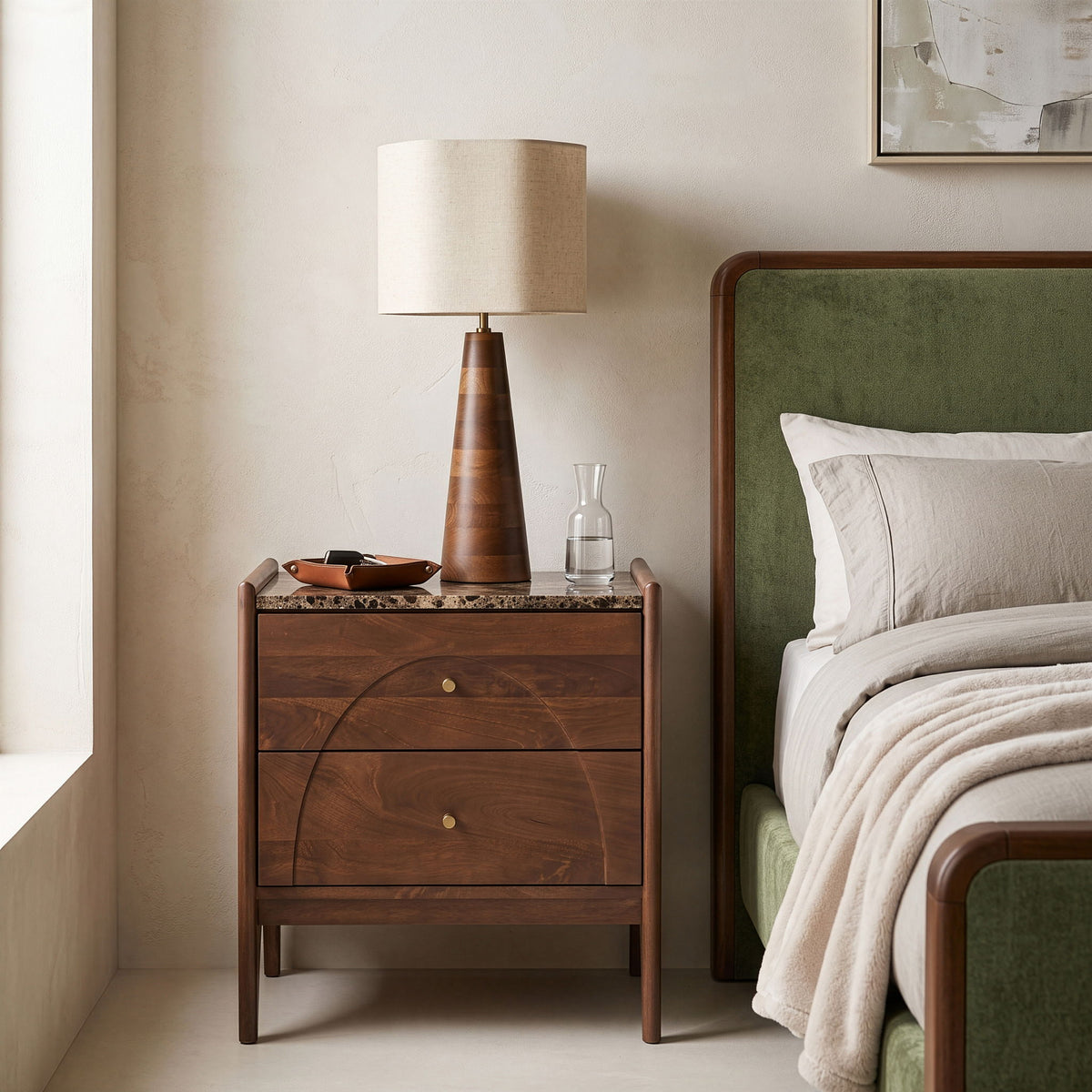 Dark brown mango wood nightstand with two drawers and brass knobs, styled in room