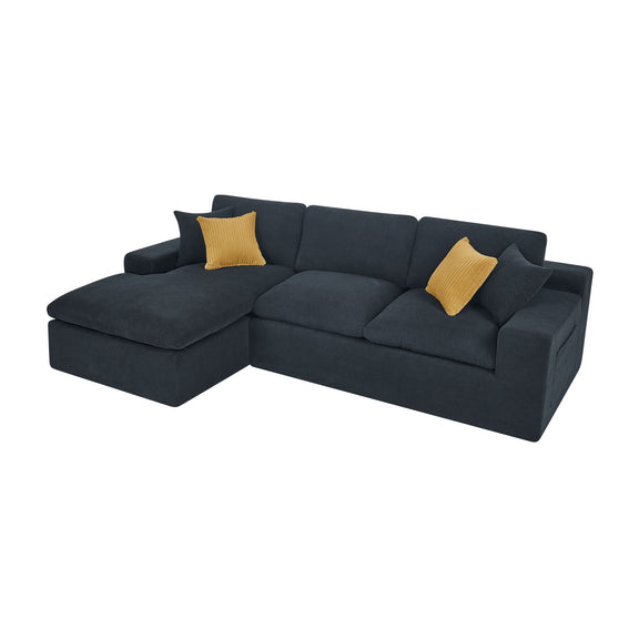 Dark gray sectional sofa with chaise and two mustard accent pillows, low-profile design
