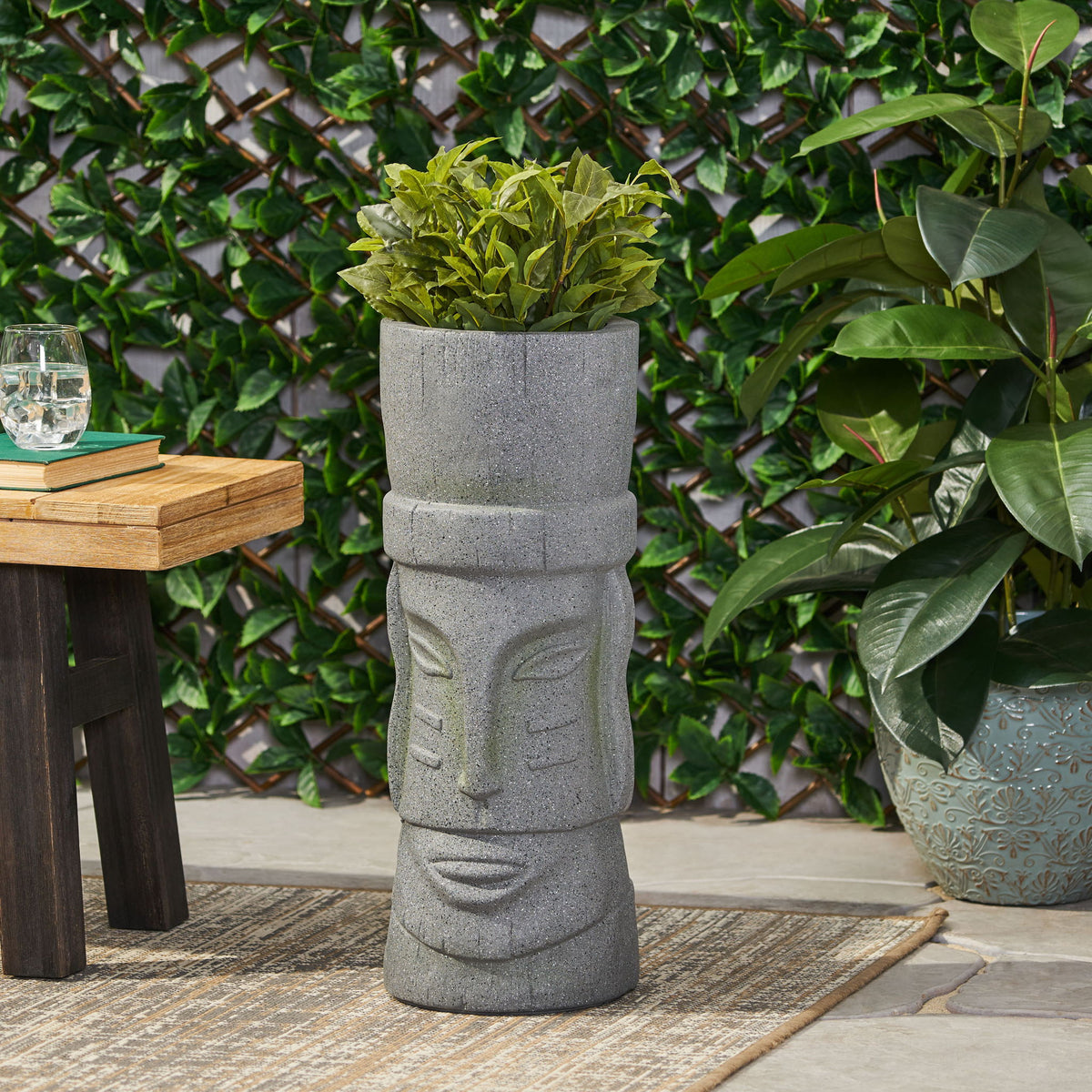 Stone gray carved column-style planter with wide mouth for flowers or plants