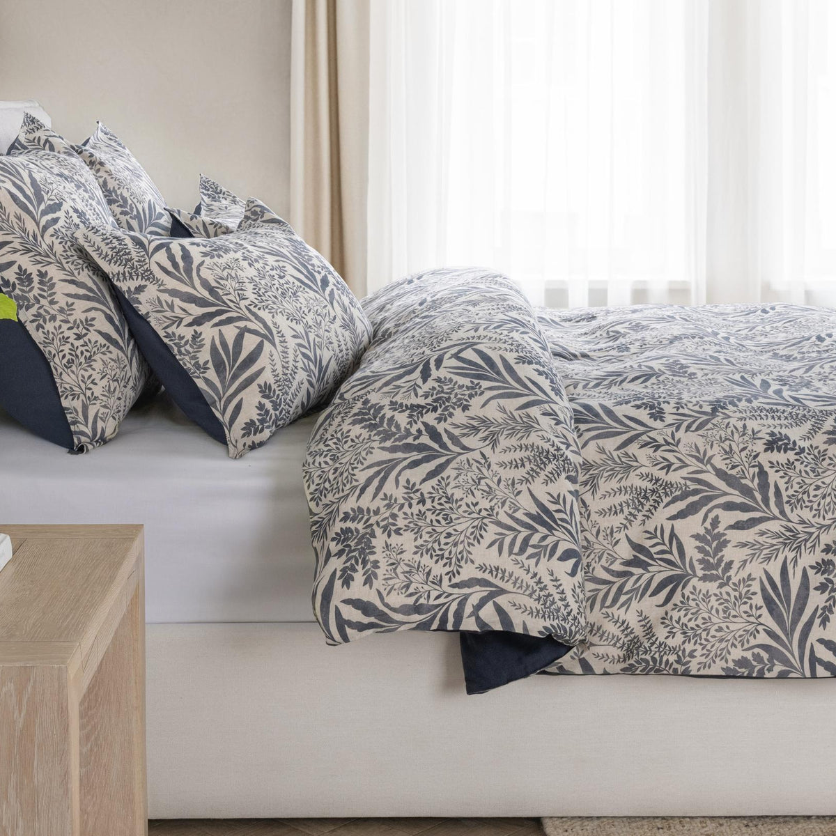 Denim blue botanical patterned decorative sham with dark border