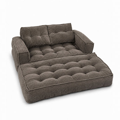 Gray corduroy modular sofa with chaise lounge, quilted seat and padded armrests
