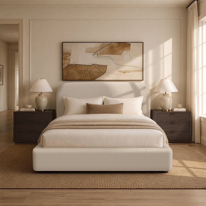 Rounded upholstered bed with beige fabric frame and padded headboard