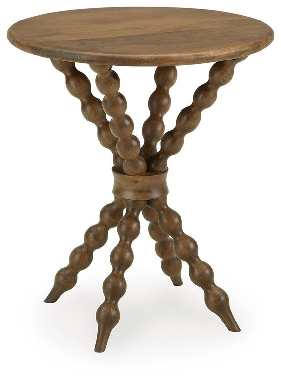 Light brown round accent table with carved trestle legs and turned base