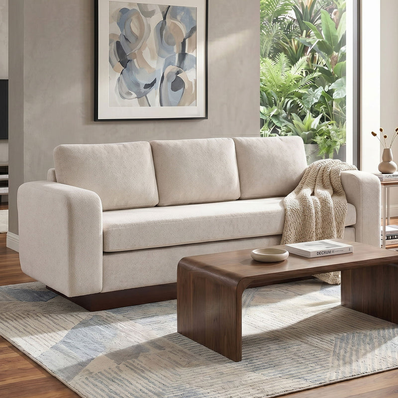 Light beige 3-seater sofa with plush square arms and back cushions