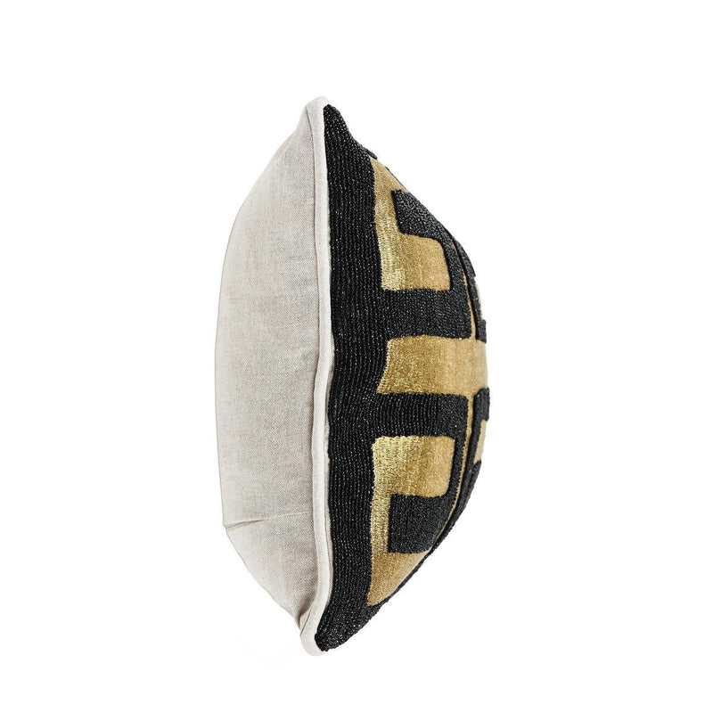 Black-and-gold geometric throw pillow side view with contrast border