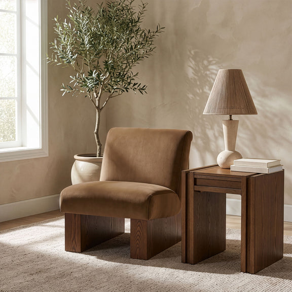 Velvet performance accent chair with brown upholstery, rounded arms, and block legs