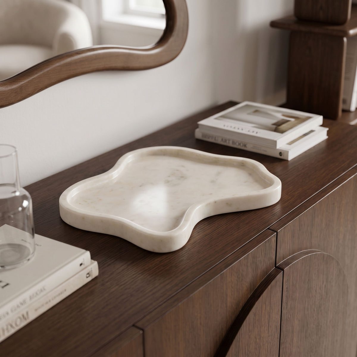 White marble serving tray with irregular wavy edges and smooth polished surface