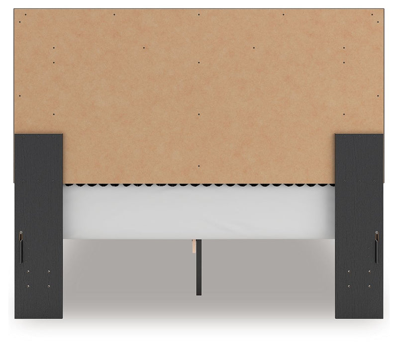 Upholstered panel platform bed base with dark side rails and tan upholstered panel