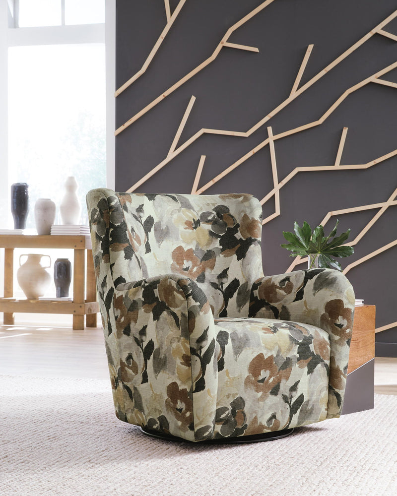 Floral swivel accent chair with green, brown, and cream upholstered arms and seat
