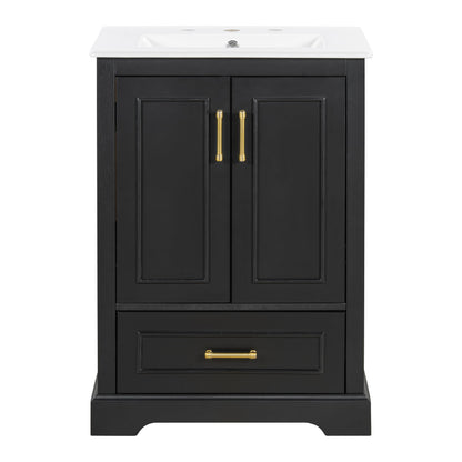 Black bathroom vanity cabinet with sink, two doors and lower drawer; gold pulls.