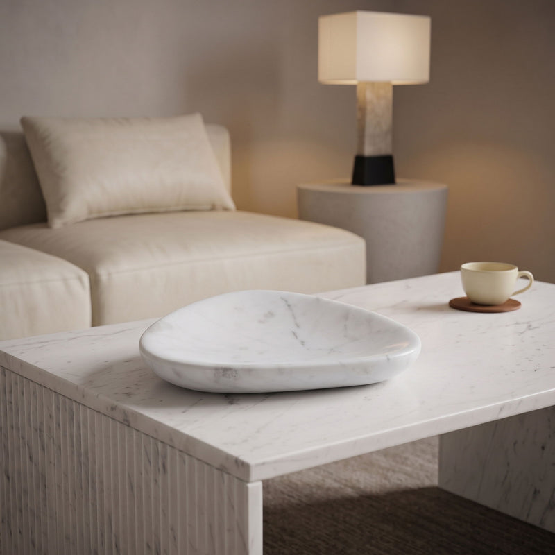 Whelan white marble bowl on a table, shallow oval dish shape