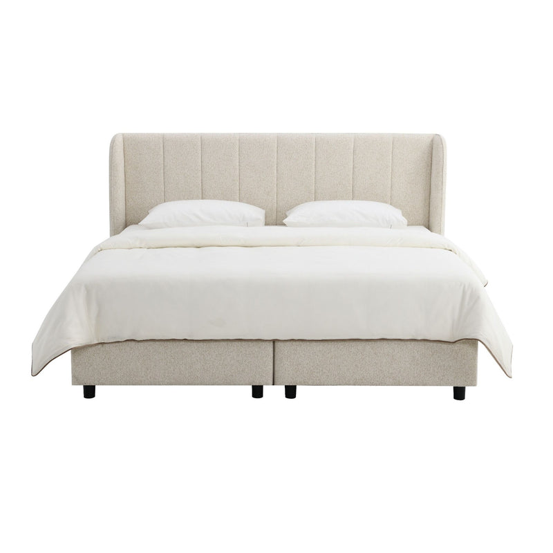 Beige upholstered platform bed with tufted headboard and fitted mattress