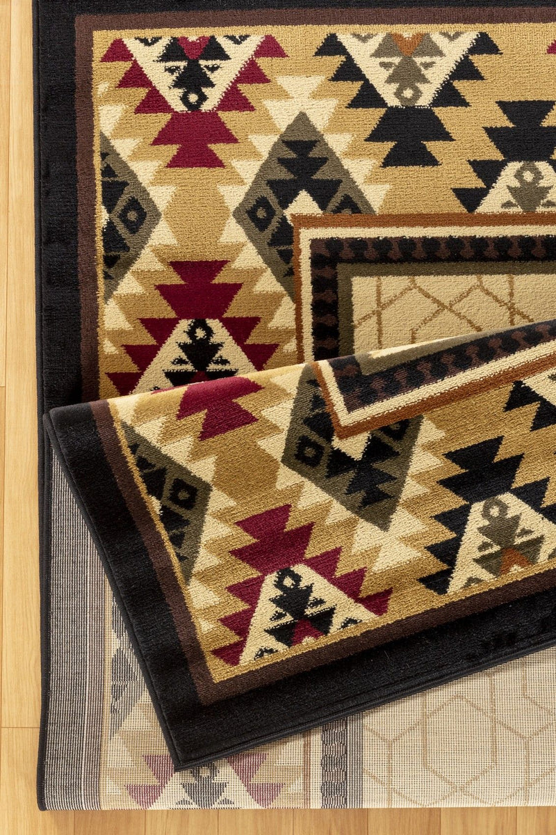 Southwest beige rug with navy border, diamond accents, and maroon geometric motifs