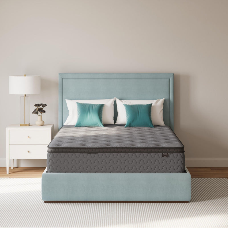 Gray firm mattress with patterned side panels and low profile black edge frame
