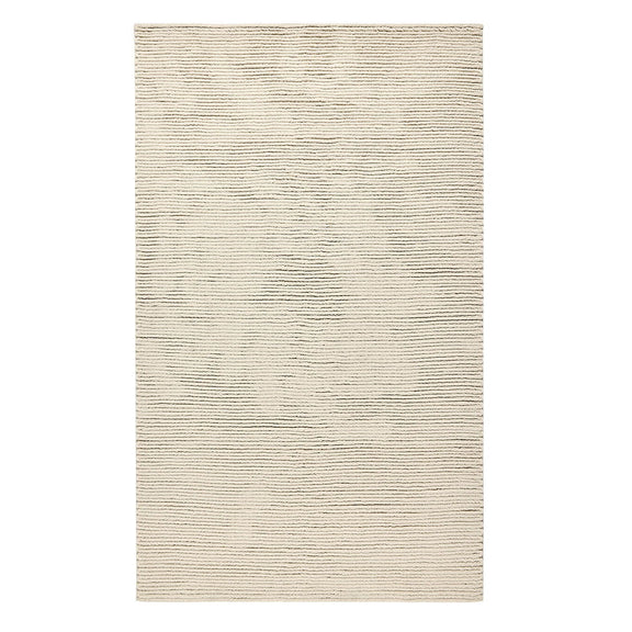 Dawson rug in light oatmeal with subtle horizontal woven texture and bound edges