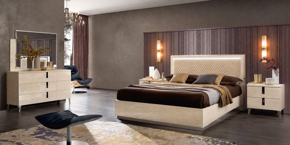 Queen upholstered bed with tufted headboard, light beige base, brown-and-beige bedding