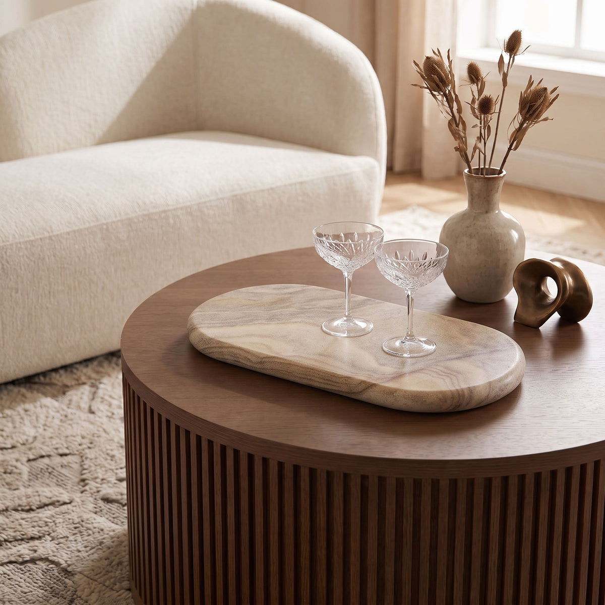 Sand marble serving tray by Carrell, oval with beige and tan stone pattern.
