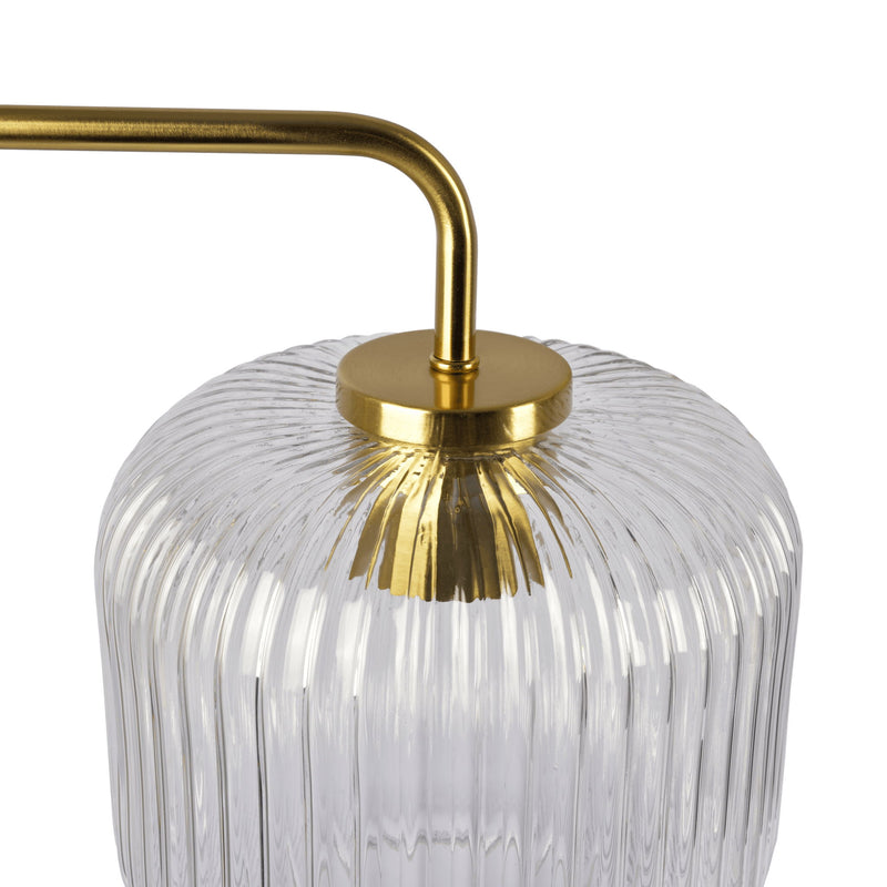 Gold stem table lamp with ribbed clear glass shade and round brass top