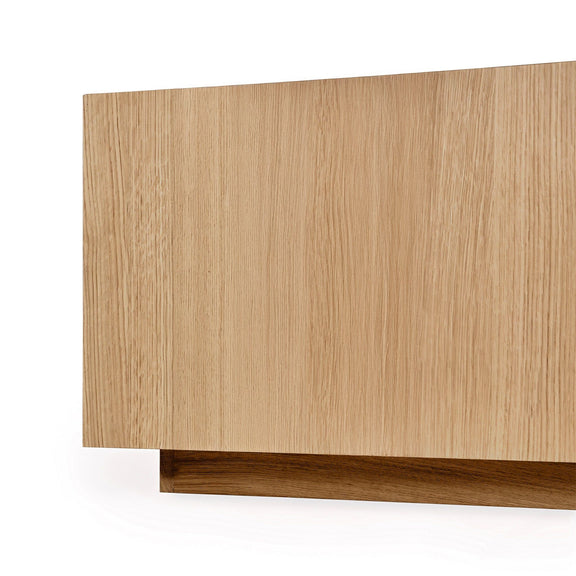 Square coffee table side view in natural oak wood with low base trim