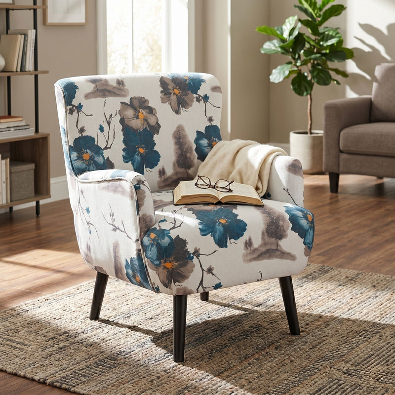 Floral armchair with round arms, white-and-blue upholstery, black legs