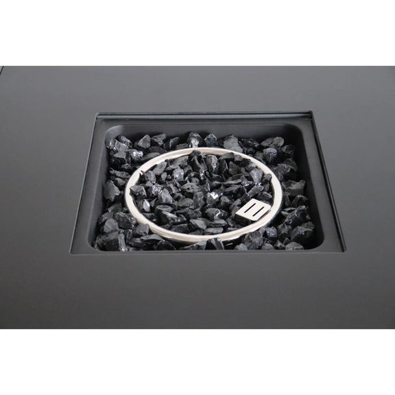 Open fire pit table showing black lava rocks in the fire bowl