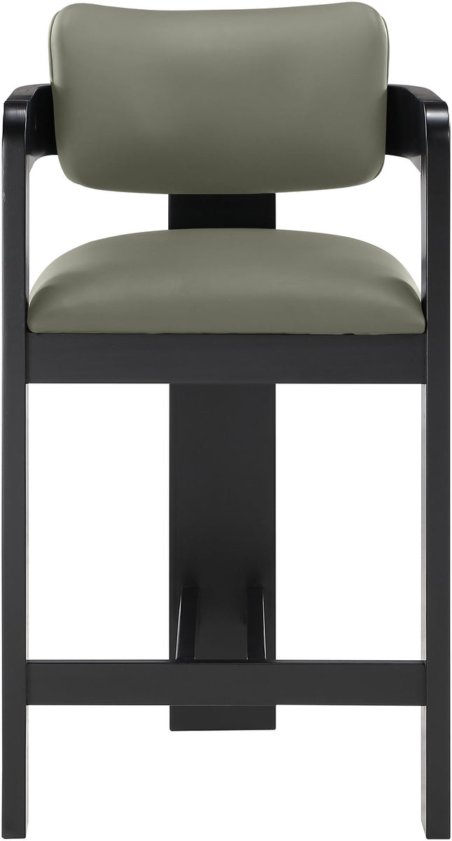 Vegan leather counter stool with sage green upholstered back and black ribbed frame