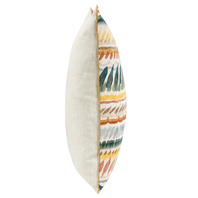 Side view of cream throw pillow with multicolor patterned insert and piped seam