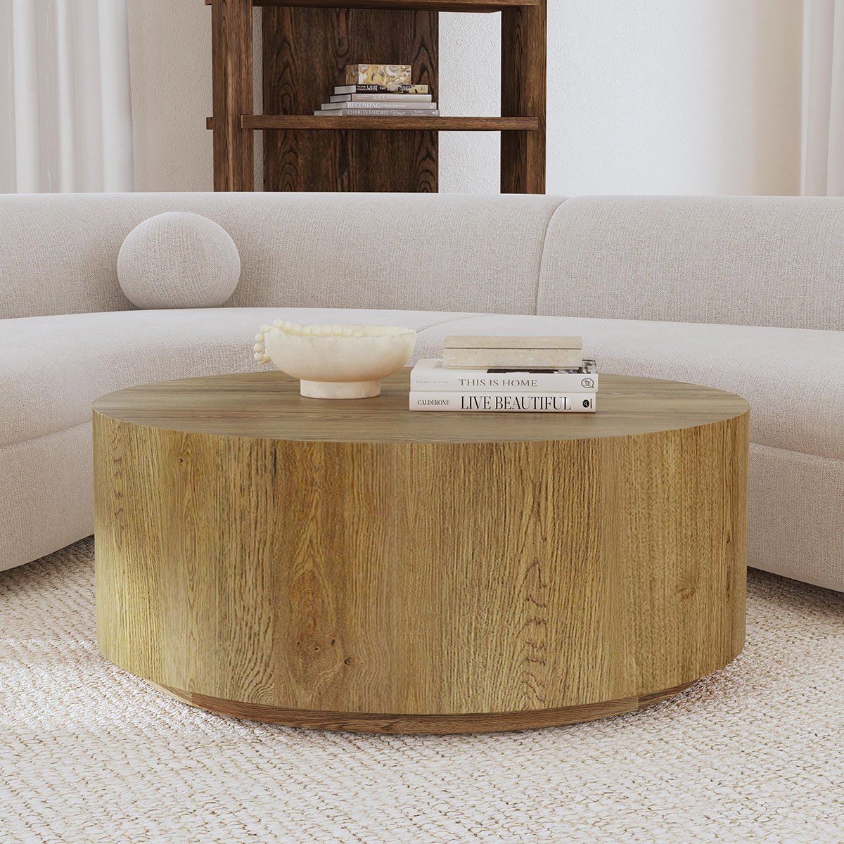 Round coffee table with natural wood finish and thick rounded base
