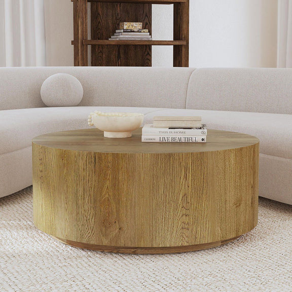 Round coffee table with natural wood finish and thick rounded base