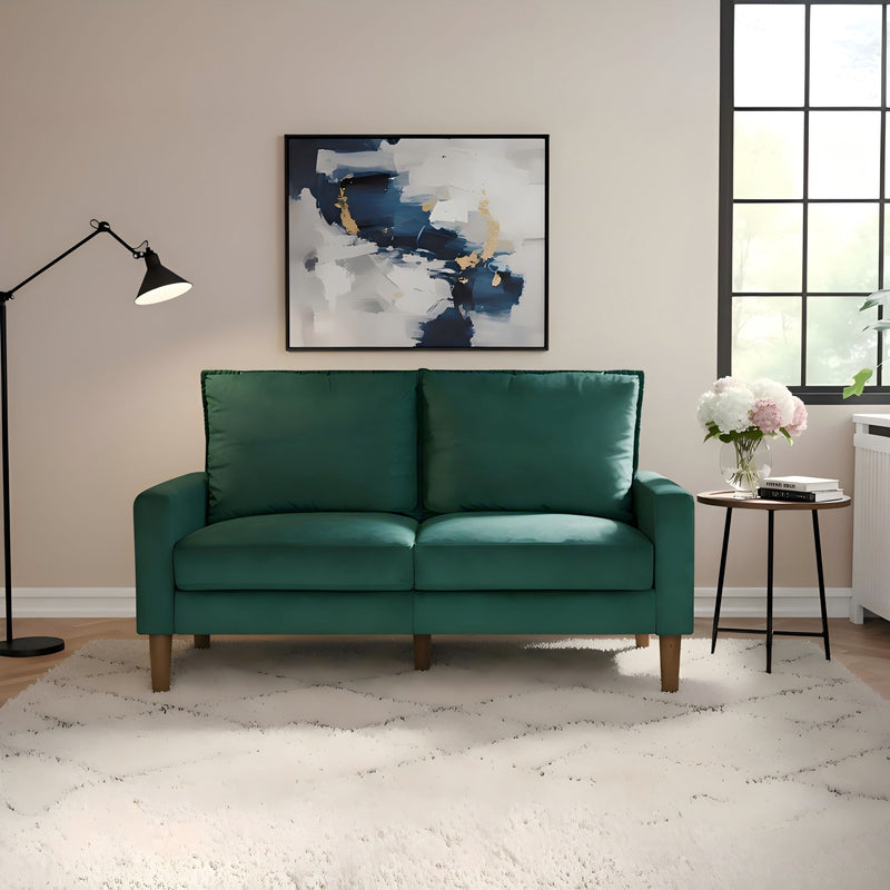 Dark green upholstered loveseat sofa with two seat cushions and tapered wooden legs