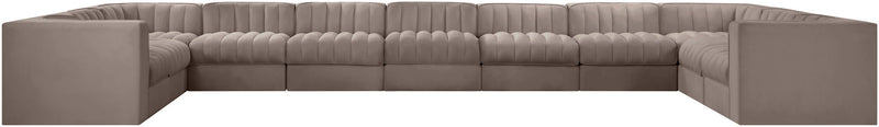 Gray velvet modular sectional sofa with tufted cushions and square arms