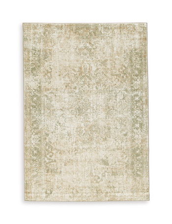 Beige area rug with distressed abstract pattern