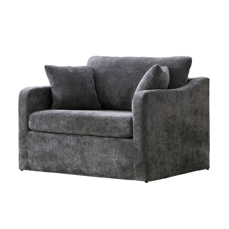 Dark gray fabric accent chair with 2 bolster pillows, wide arms, low back