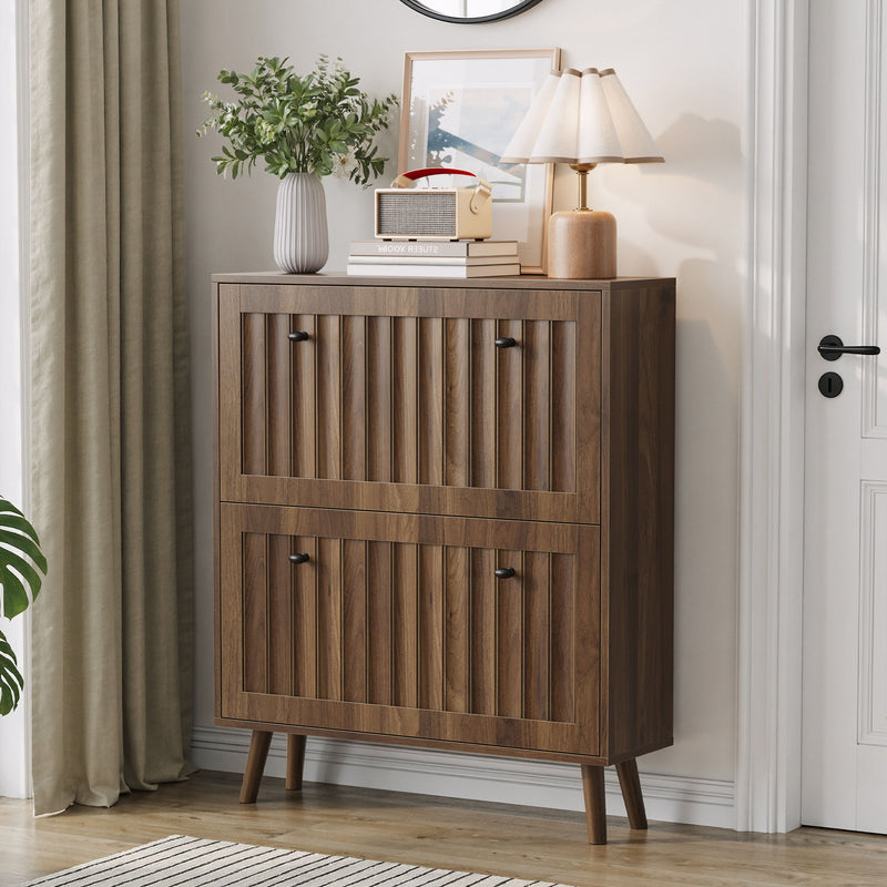 Walnut shoe cabinet with two front doors, mid shelf, and tapered wooden legs.